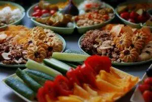 a close up of many plates of food on a table
