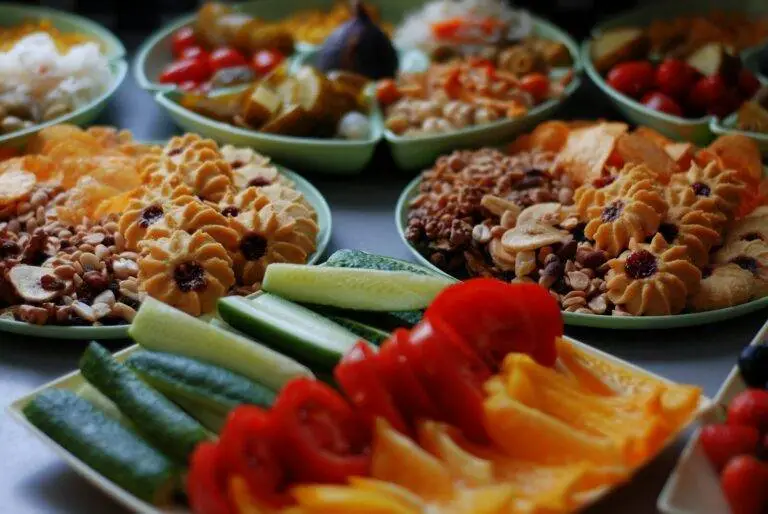 a close up of many plates of food on a table