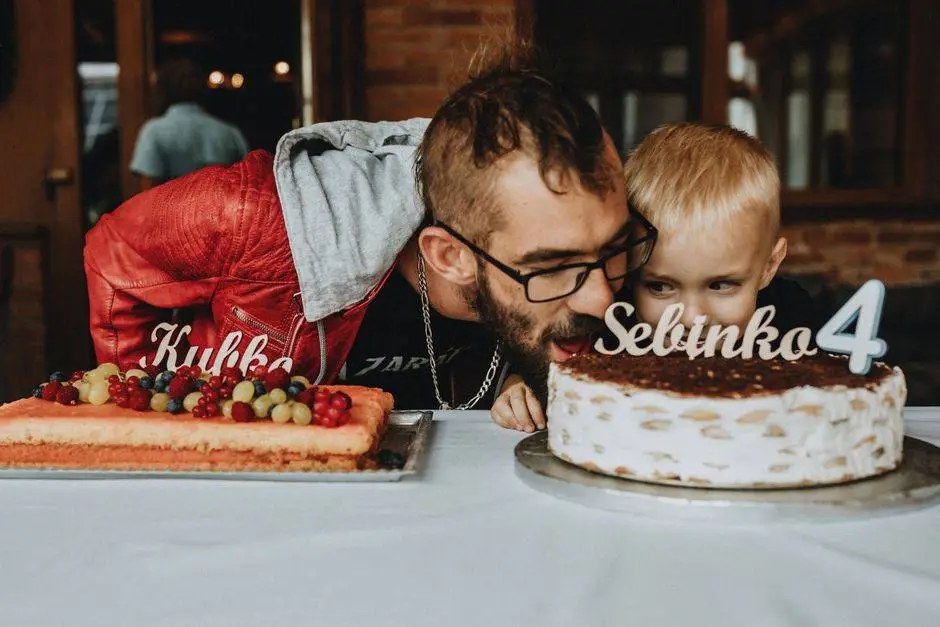 Father and child enjoying a birthday celebration with delicious cakes and festive decorations.