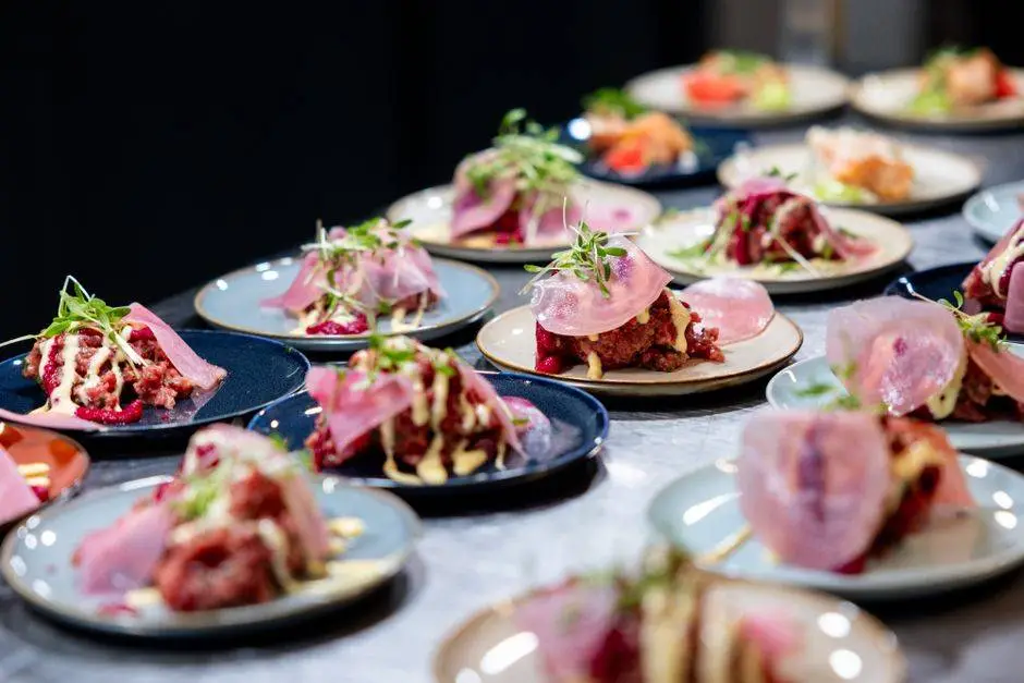 A variety of gourmet tapas presented beautifully in an upscale restaurant, highlighting culinary artistry.